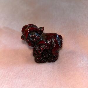 Red resin elephant figurine